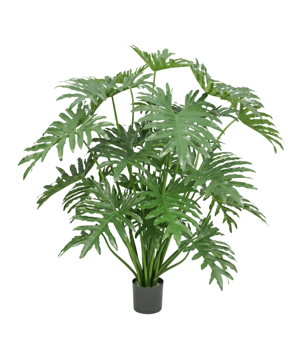 Une plante artificielle Philodendron de 125 cm avec de grandes feuilles vertes profondément fendues sur un fond blanc.