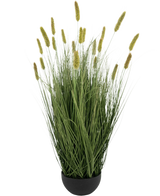 De Kunstgras Matsutake uiengraspot 90cm brandvertragend heeft hoog, kunstgrasgroen gras met donzige zaadhoofden met gele punten in een zwarte ronde pot. De lange, slanke bladeren staan rechtop voor een natuurlijke, wilde look.